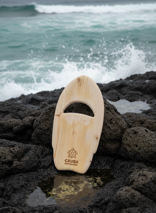Handplane on rocky coastline